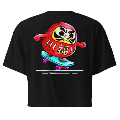 Japanese-inspired crop top featuring Daruma Skater, a playful Daruma doll riding a skateboard inspired by Japanese culture and perseverance.
