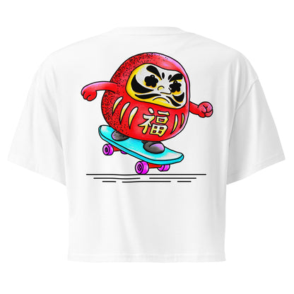 Japanese-inspired crop top featuring Daruma Skater, a playful Daruma doll riding a skateboard inspired by Japanese culture and perseverance.