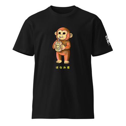 Banami-kun T-shirt featuring a cute monkey drinking banana milk in a playful Japanese JapPop illustration style