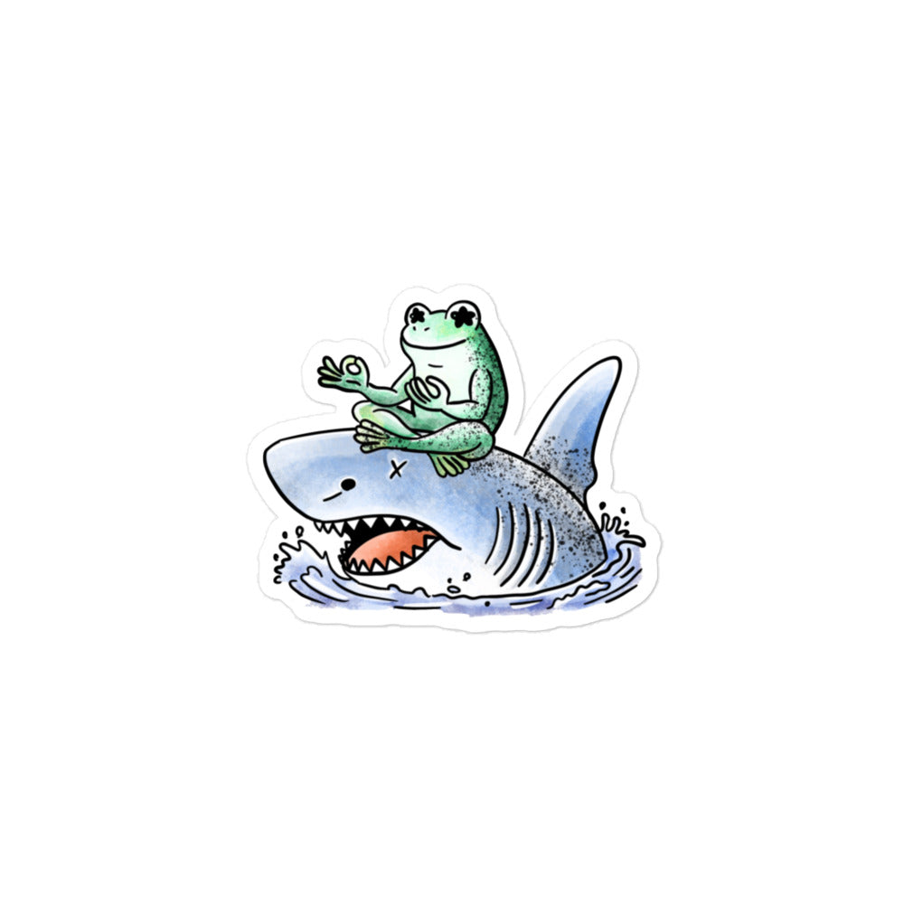 Stillness sticker illustration featuring a calm meditating frog resting on a shark, expressing balance and quiet contrast in JapPop style.