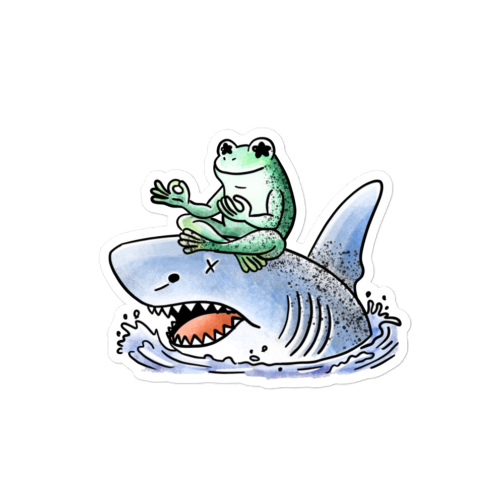 Stillness sticker illustration featuring a calm meditating frog resting on a shark, expressing balance and quiet contrast in JapPop style.