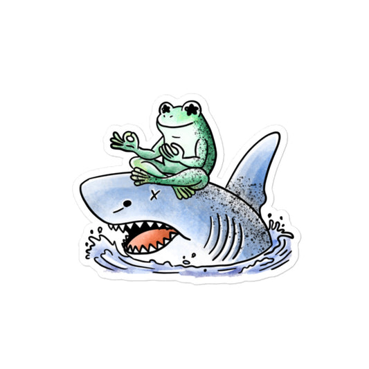 Stillness sticker illustration featuring a calm meditating frog resting on a shark, expressing balance and quiet contrast in JapPop style.